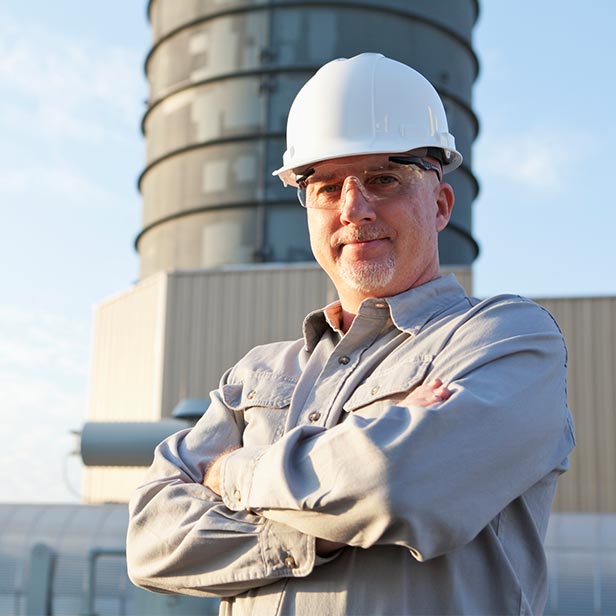 Engineer-wearing-hardhat-at-industrial-facility