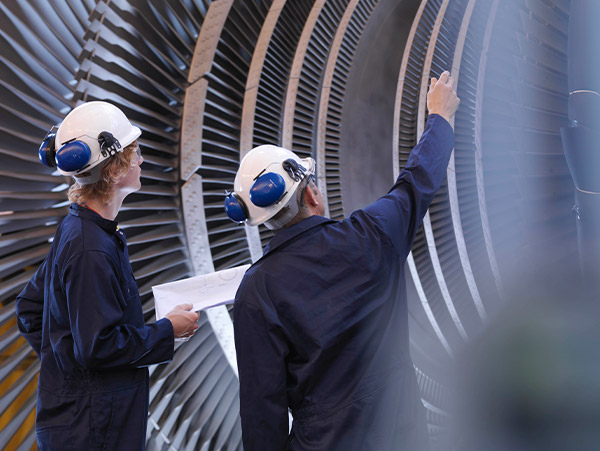 engineers looking at turbines