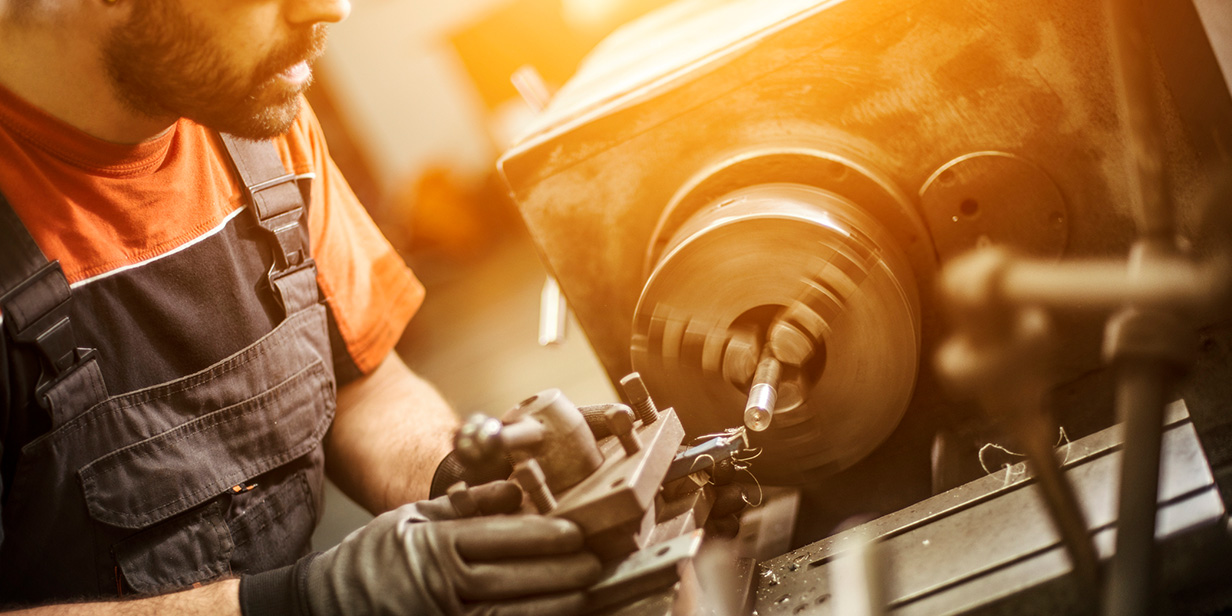 man using drill press